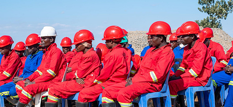 Construction workers being briefed on safety and social standards