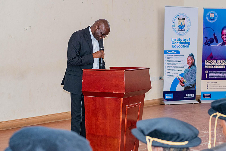 MUBAS Chaplain, Rev. Patrick M’banga offering an opening prayer